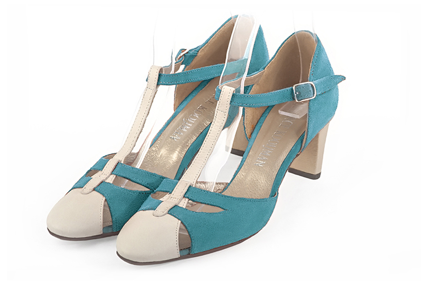 Off white and peacock blue women's T-strap open side shoes. Round toe. Medium comma heels. Front view - Florence KOOIJMAN